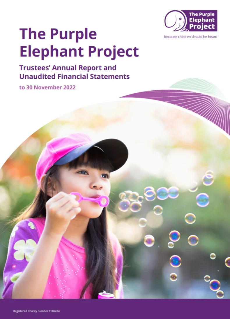 A young girl in a pink shirt and cap blows soap bubbles outdoors. The Purple Elephant Project and charity details are displayed at the top of the image.