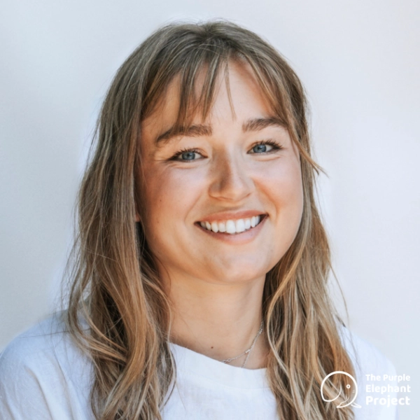 Emma Elrington, a smiling woman with light brown hair.